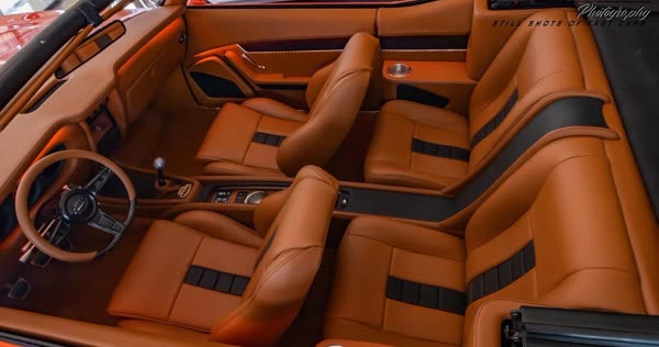 Tan and black leather interior of a 1969 Pontiac GTO