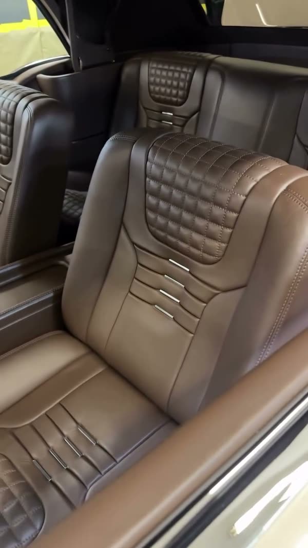 Brown quilted leather seats in Elegant Lady, a 1956 Chevrolet Bel Air convertible